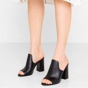 Aldo beautiful black leather block heel sandal.